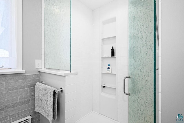 2900 London Rd, Duluth, MN 55804 - full bath featuring a stall shower, radiator heating unit, and tile walls