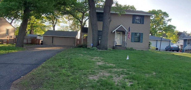 10414 Terrace Rd NE, Blaine, MN 55434 - traditional-style house with a detached garage, a front yard, and an outdoor structure