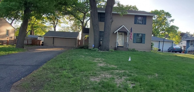 10414 Terrace Rd NE, Blaine, MN 55434 - traditional-style home with a detached garage, a front yard, and an outbuilding