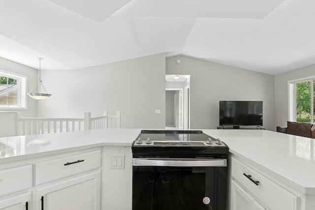 2035 123rd Ave NW, Coon Rapids, MN 55448 - kitchen featuring electric range, open floor plan, light countertops, white cabinetry, and vaulted ceiling