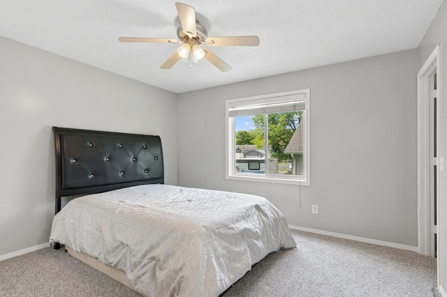 2035 123rd Ave NW, Coon Rapids, MN 55448 - bedroom featuring carpet floors, baseboards, and ceiling fan