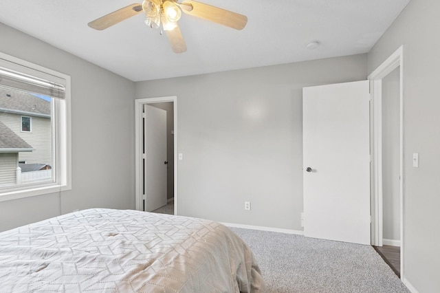 2035 123rd Ave NW, Coon Rapids, MN 55448 - carpeted bedroom featuring baseboards and a ceiling fan