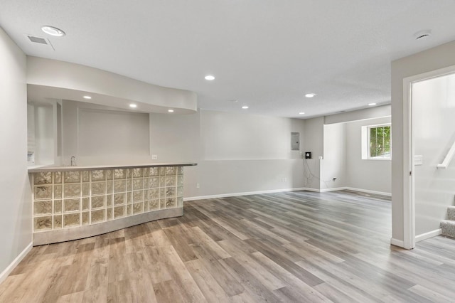2035 123rd Ave NW, Coon Rapids, MN 55448 - basement with baseboards, wood finished floors, stairway, electric panel, and recessed lighting