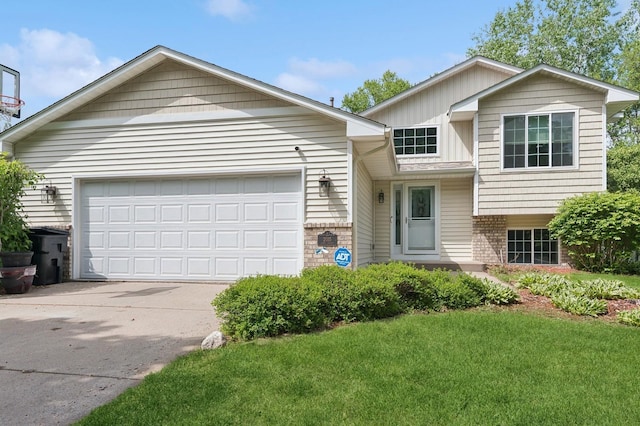 2035 123rd Ave NW, Coon Rapids, MN 55448 - view of front of house with concrete driveway, a front yard, board and batten siding, and an attached garage