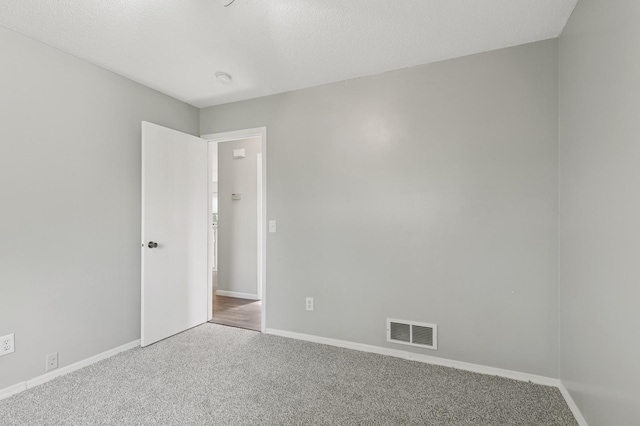2035 123rd Ave NW, Coon Rapids, MN 55448 - carpeted empty room featuring baseboards