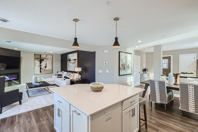 21749 Lilac Dr, Farmington, MN 55024 - kitchen featuring open floor plan, dark wood-style floors, a center island, and recessed lighting
