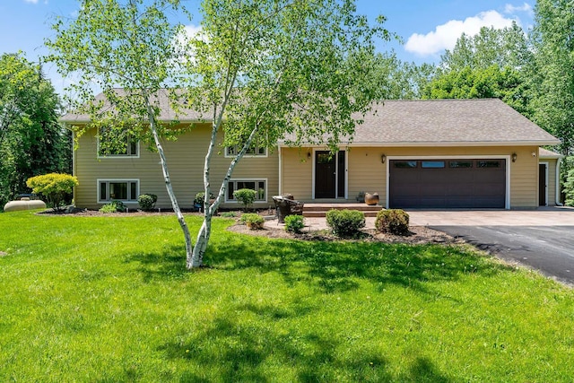21570 France Blvd, Credit River Twp, MN 55044 - tri-level home with a garage, asphalt driveway, a front lawn, and a shingled roof