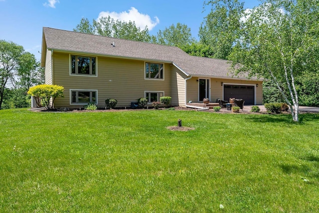 21570 France Blvd, Credit River Twp, MN 55044 - rear view of house featuring a lawn and a garage