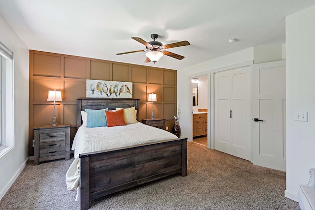21570 France Blvd, Credit River Twp, MN 55044 - carpeted bedroom with ensuite bath, ceiling fan, and baseboards