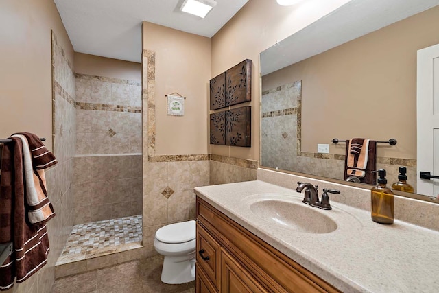 21570 France Blvd, Credit River Twp, MN 55044 - full bathroom with toilet, a walk in shower, vanity, tile walls, and tile patterned flooring
