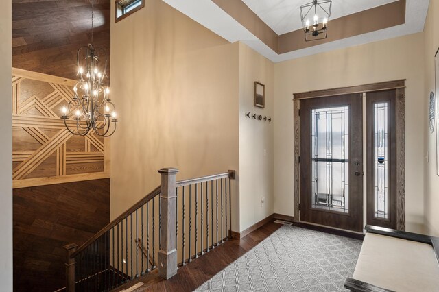 8530 Fir St, Greenfield, MN 55373 - foyer featuring a chandelier, wood finished floors, a towering ceiling, and baseboards