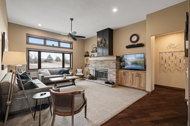 8530 Fir St, Greenfield, MN 55373 - living area featuring dark wood-style floors, a fireplace, a ceiling fan, recessed lighting, and baseboards