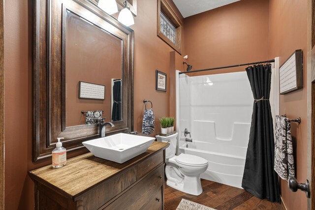 8530 Fir St, Greenfield, MN 55373 - full bath with toilet, vanity, shower / bathtub combination with curtain, and wood finished floors