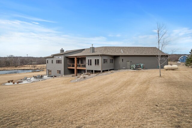 8530 Fir St, Greenfield, MN 55373 - back of property featuring a chimney and a shingled roof