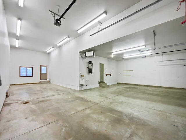 1101 Golfers Ct SE, Rochester, MN 55904 - garage with a central vacuum unit and a garage door opener