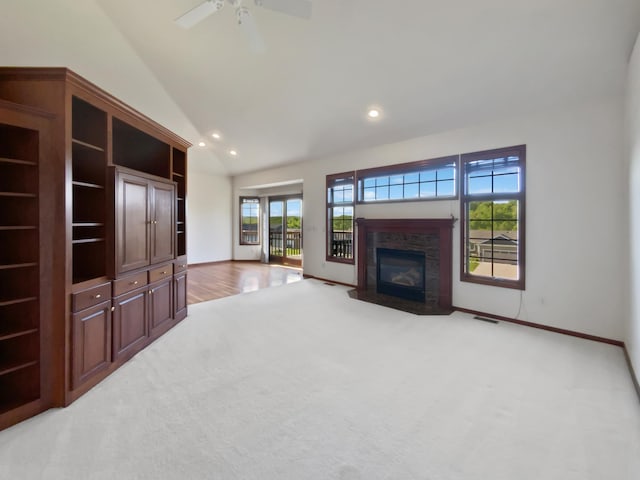 1101 Golfers Ct SE, Rochester, MN 55904 - unfurnished living room with carpet flooring, a fireplace with flush hearth, recessed lighting, ceiling fan, and baseboards