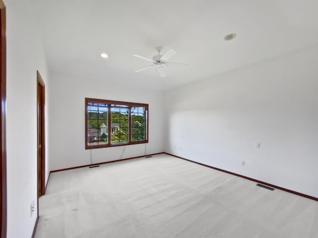 1101 Golfers Ct SE, Rochester, MN 55904 - unfurnished room featuring light colored carpet, ceiling fan, baseboards, and recessed lighting