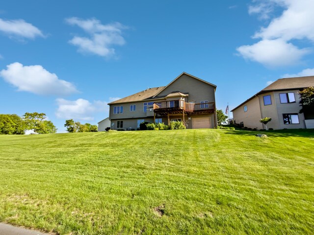 1101 Golfers Ct SE, Rochester, MN 55904 - rear view of house featuring a garage, a wooden deck, and a lawn