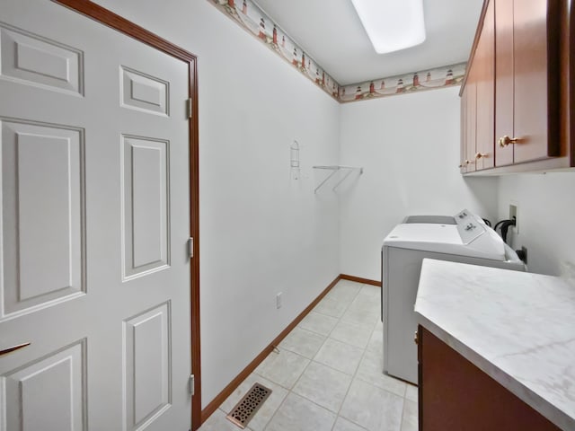 1101 Golfers Ct SE, Rochester, MN 55904 - laundry room featuring cabinet space, independent washer and dryer, light tile patterned floors, and baseboards