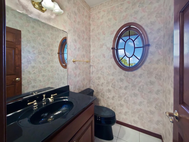 1101 Golfers Ct SE, Rochester, MN 55904 - bathroom featuring tile patterned flooring, toilet, vanity, baseboards, and wallpapered walls