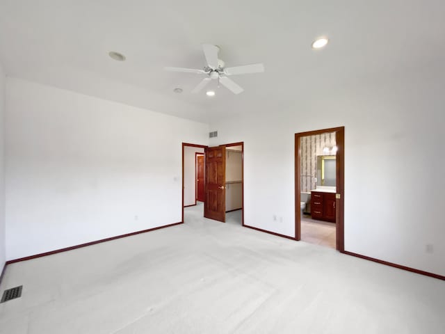 1101 Golfers Ct SE, Rochester, MN 55904 - unfurnished bedroom featuring recessed lighting, baseboards, light colored carpet, a walk in closet, and ensuite bath