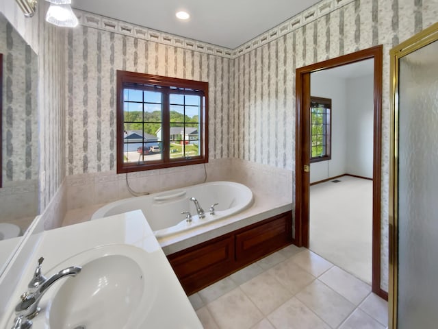 1101 Golfers Ct SE, Rochester, MN 55904 - full bathroom with a sink, wallpapered walls, a garden tub, tile patterned flooring, and a shower stall