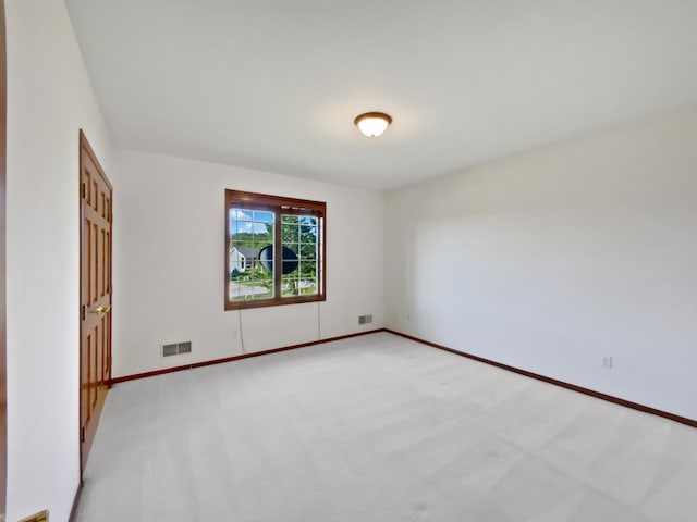 1101 Golfers Ct SE, Rochester, MN 55904 - spare room featuring light colored carpet and baseboards