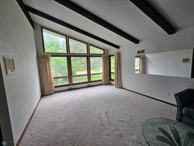 103 4th St S, Fairmount, ND 58030 - unfurnished living room with baseboards, a textured wall, and carpet floors