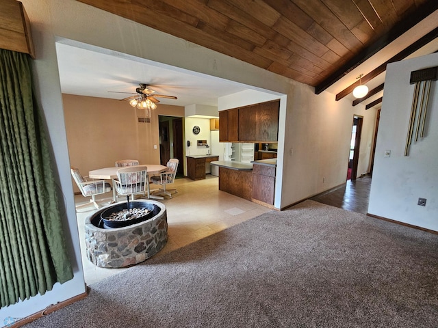 103 4th St S, Fairmount, ND 58030 - living area with ceiling fan, carpet, baseboards, and wooden ceiling