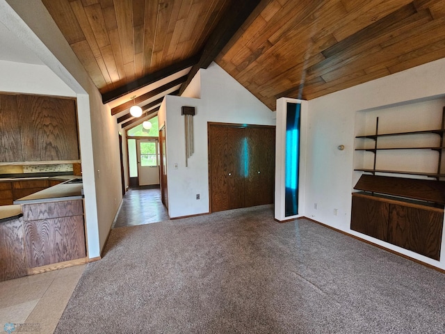 103 4th St S, Fairmount, ND 58030 - unfurnished living room featuring wooden ceiling, carpet floors, and baseboards