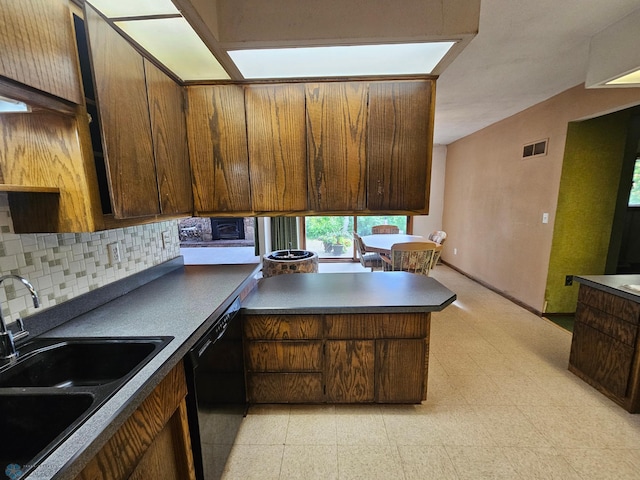 103 4th St S, Fairmount, ND 58030 - kitchen featuring a sink, dishwasher, backsplash, light floors, and a peninsula