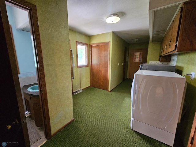 103 4th St S, Fairmount, ND 58030 - laundry room with cabinet space, washer and clothes dryer, and carpet floors