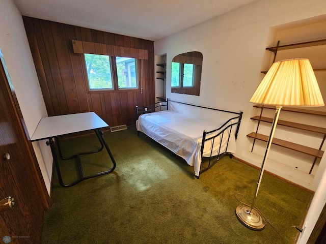 103 4th St S, Fairmount, ND 58030 - carpeted bedroom featuring wood walls