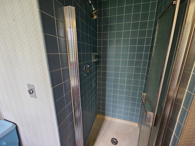 103 4th St S, Fairmount, ND 58030 - bathroom featuring a shower stall, wallpapered walls, and toilet