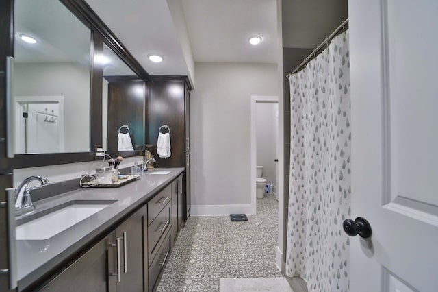 23904 Summer Haven Ln, Nisswa, MN 56468 - full bath featuring baseboards, double vanity, toilet, and curtained shower