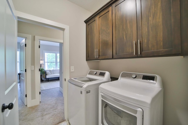 23904 Summer Haven Ln, Nisswa, MN 56468 - laundry area with washer and dryer, cabinet space, light carpet, and baseboards