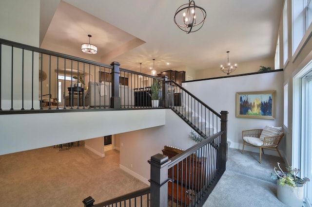 23904 Summer Haven Ln, Nisswa, MN 56468 - stairway with carpet, a chandelier, and baseboards