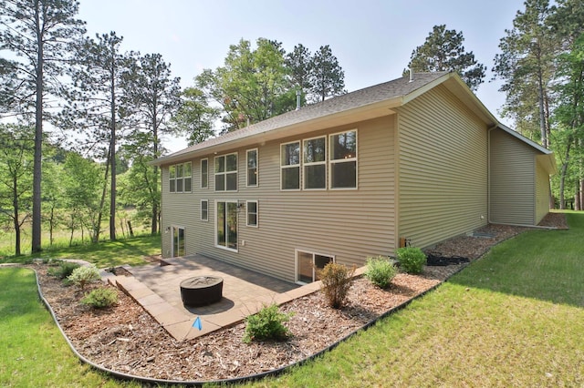23904 Summer Haven Ln, Nisswa, MN 56468 - rear view of property with an outdoor fire pit, a patio, and a lawn