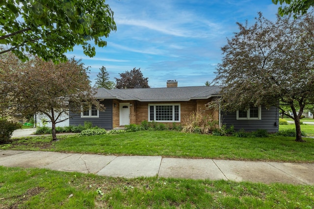 705 10th St SW, Rochester, MN 55902 - ranch-style house featuring a chimney and a front yard