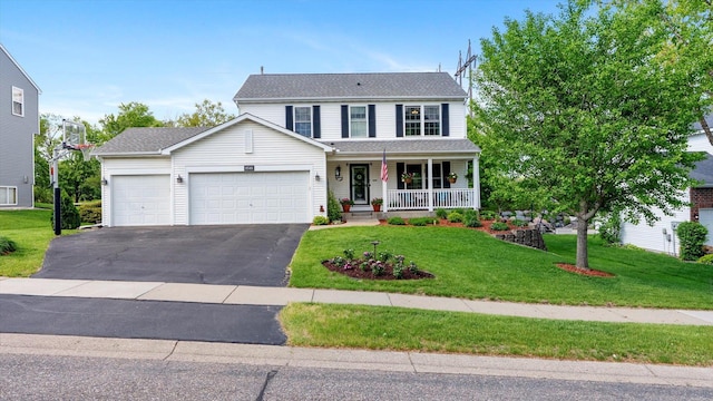 8548 139th St, Savage, MN 55378 - traditional home with covered porch, an attached garage, asphalt driveway, and a front yard