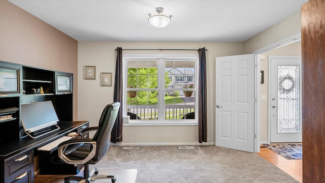 8548 139th St, Savage, MN 55378 - carpeted home office with a textured ceiling and baseboards