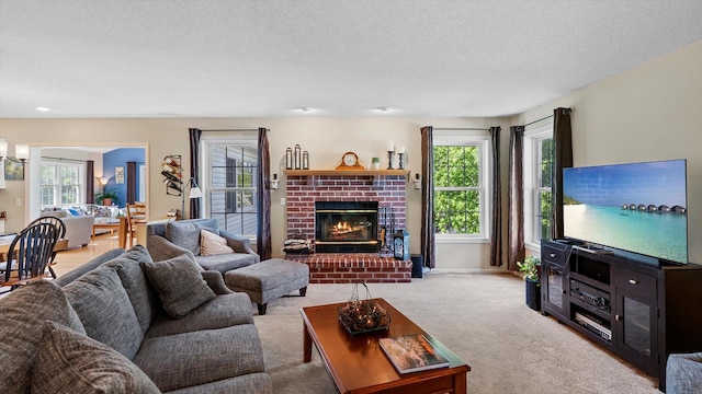 8548 139th St, Savage, MN 55378 - carpeted living area featuring a textured ceiling, healthy amount of natural light, and a fireplace