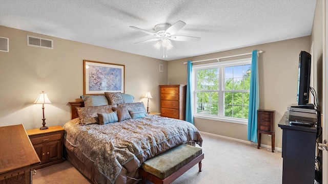 8548 139th St, Savage, MN 55378 - bedroom featuring light colored carpet, baseboards, a textured ceiling, and a ceiling fan