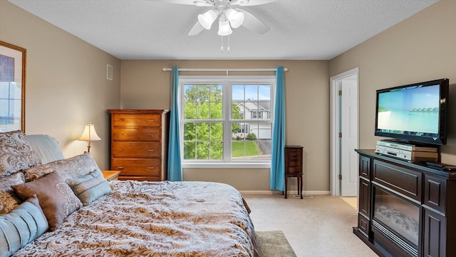 8548 139th St, Savage, MN 55378 - bedroom featuring light colored carpet, a textured ceiling, baseboards, and ceiling fan