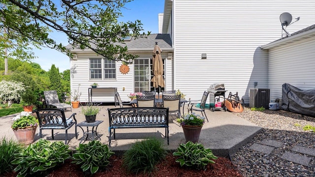 8548 139th St, Savage, MN 55378 - view of patio with outdoor dining area and central AC unit
