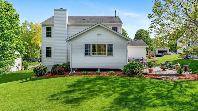8548 139th St, Savage, MN 55378 - rear view of house featuring a patio area, a lawn, and a chimney