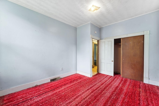 691 Burr St, Saint Paul, MN 55130 - unfurnished bedroom with ornamental molding, baseboards, a closet, and carpet flooring