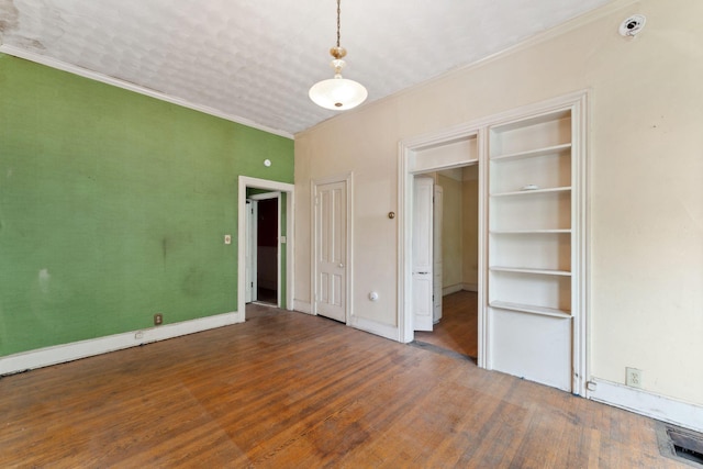 691 Burr St, Saint Paul, MN 55130 - unfurnished bedroom featuring wood finished floors, crown molding, and baseboards