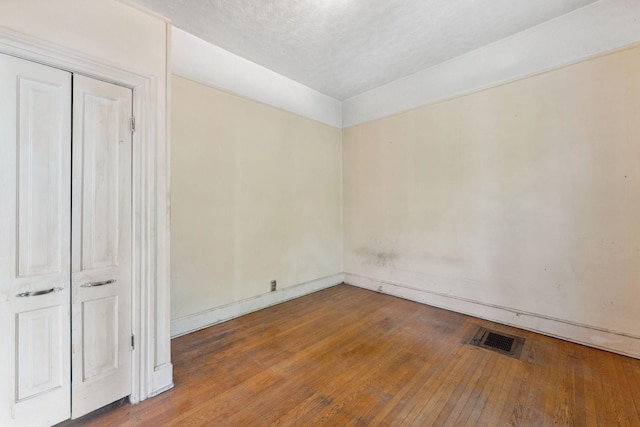 691 Burr St, Saint Paul, MN 55130 - unfurnished room featuring wood-type flooring and baseboards
