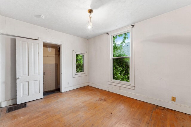 691 Burr St, Saint Paul, MN 55130 - unfurnished bedroom with light wood-type flooring and baseboards